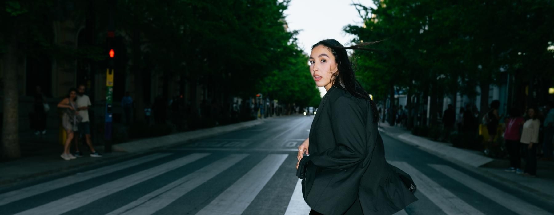 a woman walking on a street