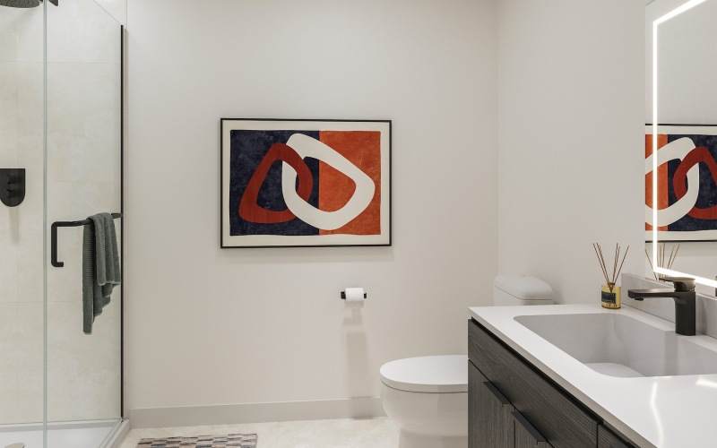 a bathroom with a shower, toilet and a sink
