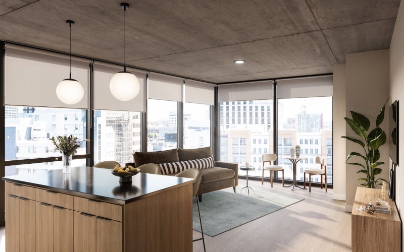 a living room with a couch and large windows