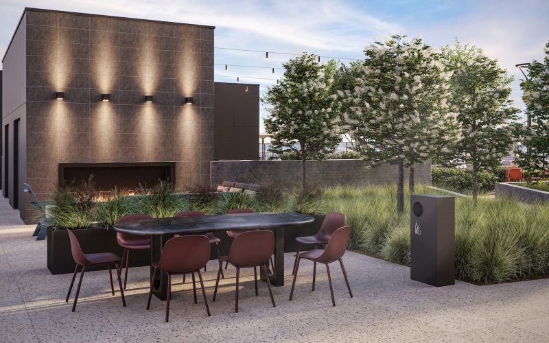 a courtyard with a table and chairs